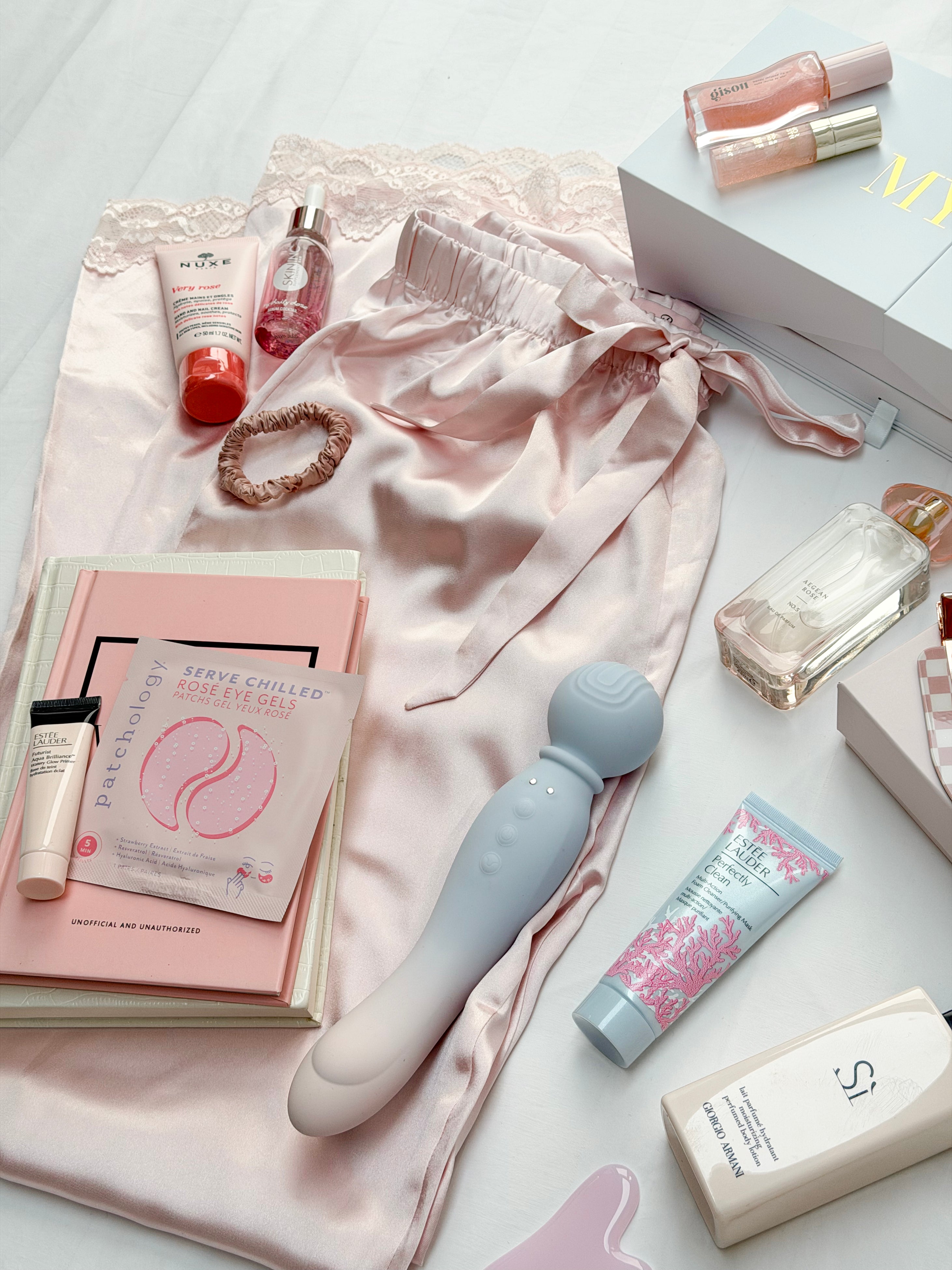 Light blue and white silicone vibrato toy with rounded head and textured grip