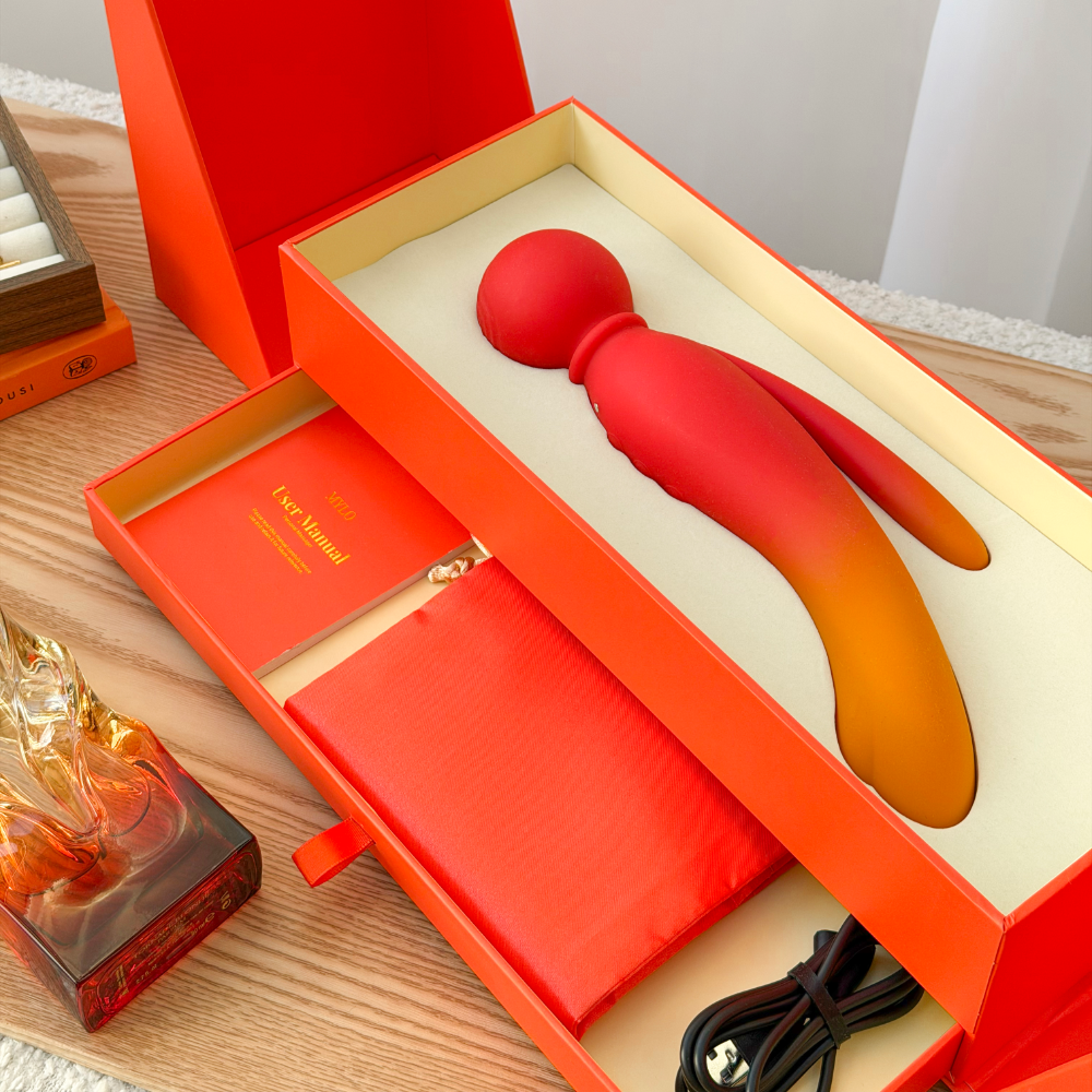 Red and orange gradient silicone vibrato wand in a luxurious orange gift box.