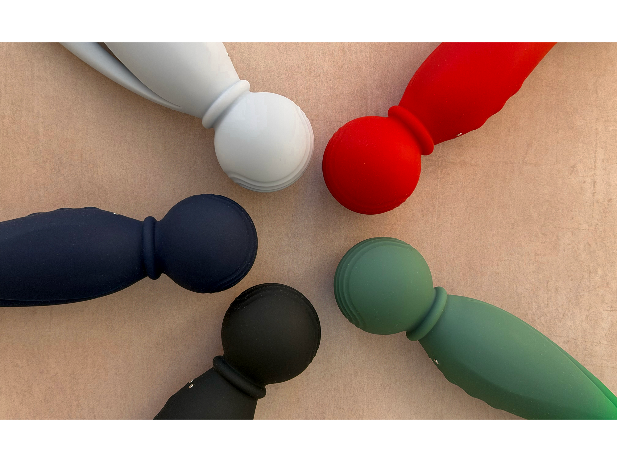 A set of five vibrators in white, red, navy blue, black, and sage green.